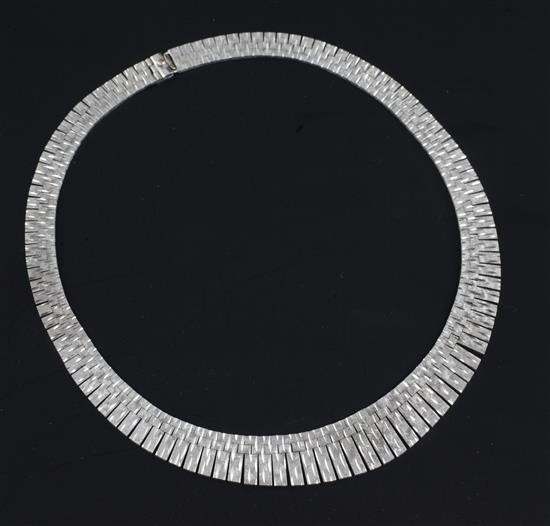 A 1980s textured 9ct white gold fringe necklace, 16.75in.